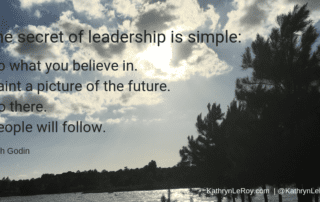 leadership secret quote over view of lake and clouds