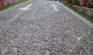 cobblestone road with areas pointing in opposite directions represents chasing intention and routines