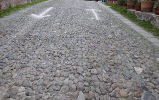 cobblestone road with areas pointing in opposite directions represents chasing intention and routines