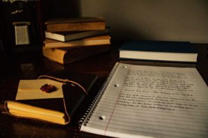 writing desk with notebook and pens-vulnerability in writing
