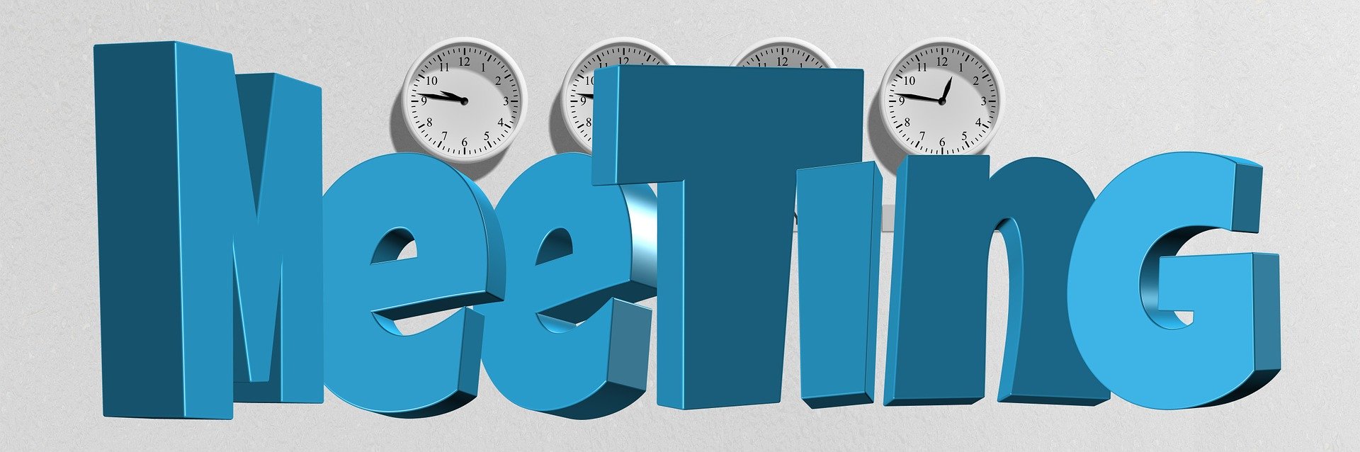 the word meeting in large 3-d block letters in blue with clocks in the background