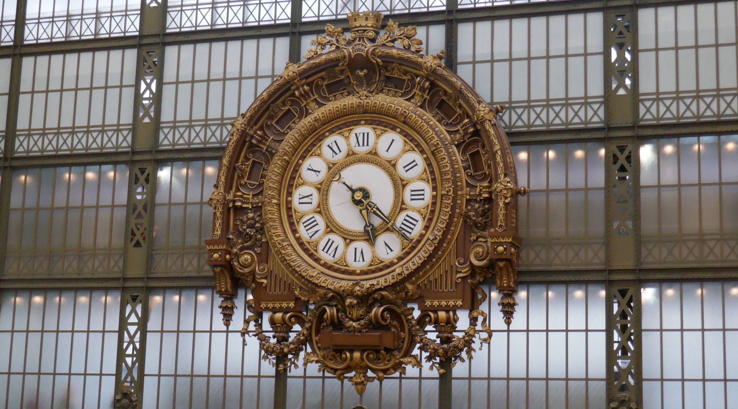 the large gold-colored clock in the Musee d'Orsay-defining moments