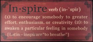 dark red black with the word inspire and its definition to chose the best word for life