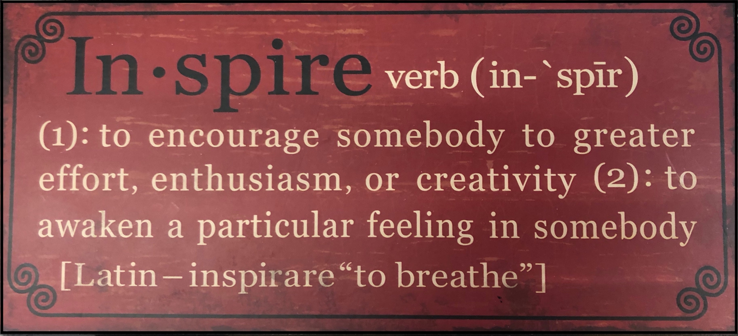 dark red black with the word inspire and its definition to chose the best word for life