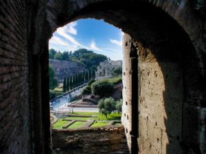 a view from a door of the Colosseum in Rome. Italy looking out at the countryside and blue skies on a single day