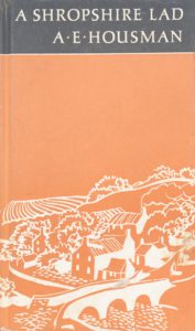 Book cover of A Shropshire Lad by A.E. Housman. The cover is a muted orange with a drawing of hills, fields, a cottage, and a bridge over a stream.