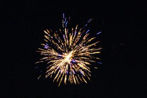 Single firework display against a black sky
