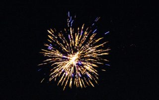 Single firework display against a black sky